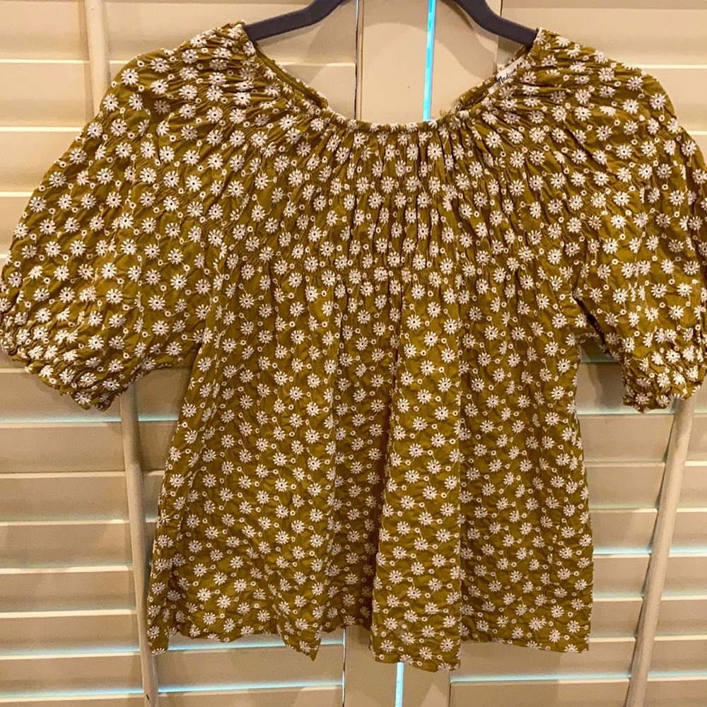 All over embroidered top.